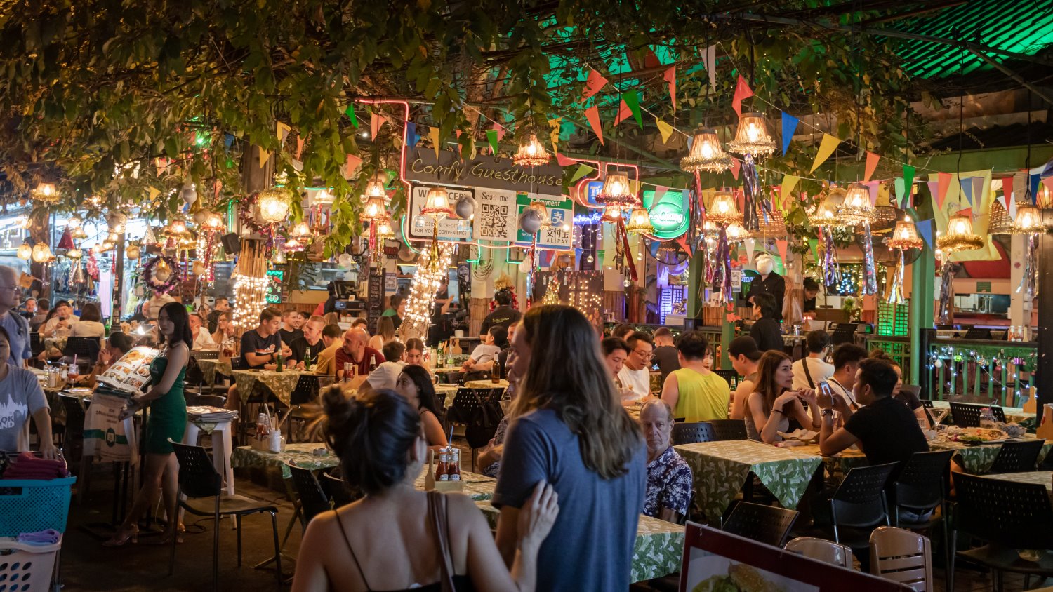 couple heading into a packed restaurant